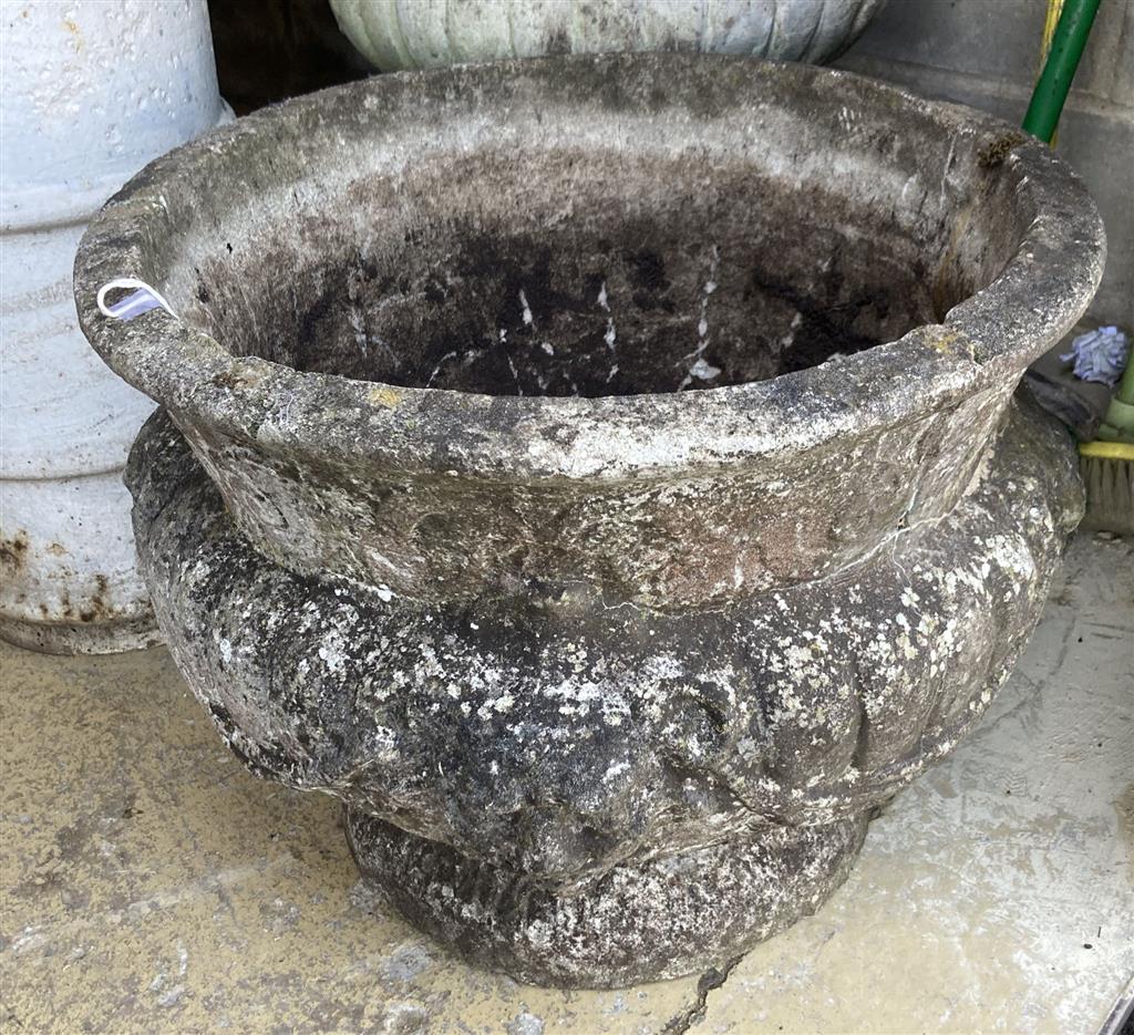 A reconstituted stone garden planter, 52cm diameter, height 40cm